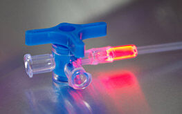 Tube set assembly with medical adhesives