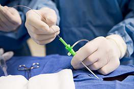 Orange fluorescing catheter adhesive